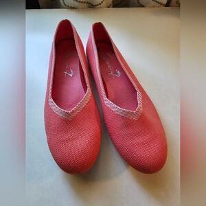 Coral colored flats.